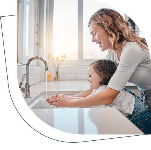 Women washing hands with her daughter