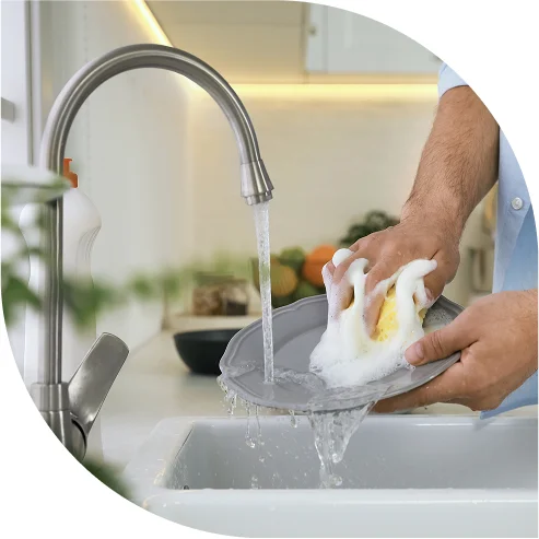 Person Washing Dishes