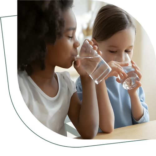 Children drinking clean filtered water in Keller TX home supported by Polly Plumbing services