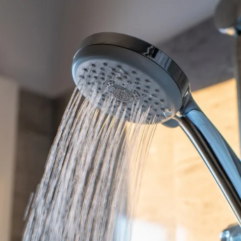 Steady hot water flow from shower representing water heater repair service in Keller Texas